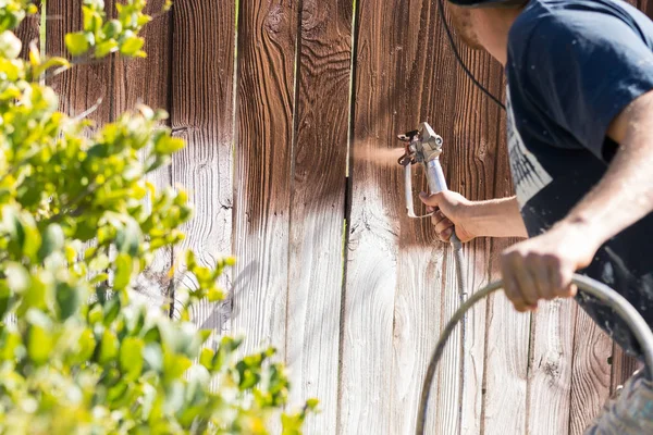 Professional Painter Spraying House Yard Fence Wood Stain — Stock Photo, Image