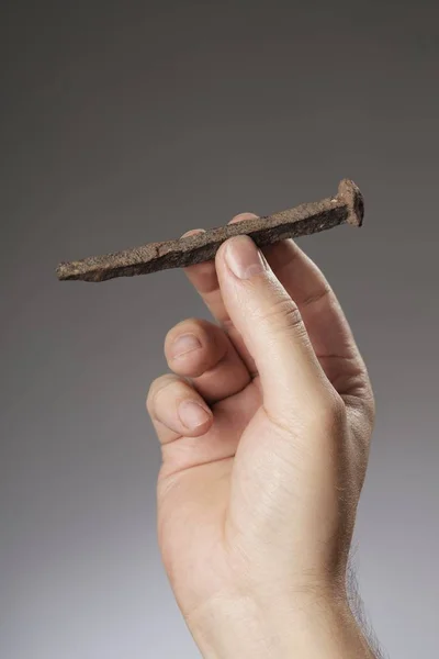 Man Holding Old Rusty Nail His Hand — Stock Photo, Image