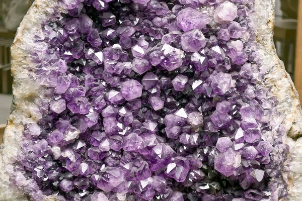 Beautiful deep purple ametyst crystals in the form of six wall pyramids.