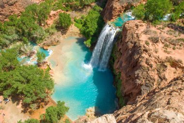 Havasu Falls in the daytime from the mesa above the falls. Wonderfull shadow from the sunlight in the spring. clipart