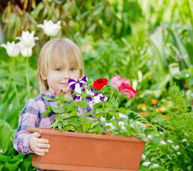 Little girl holding container with flowers clipart