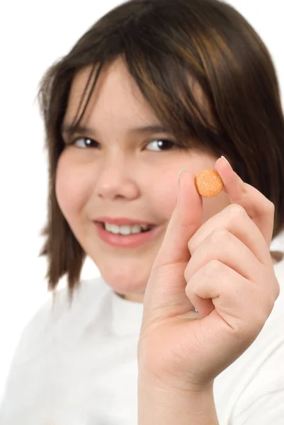Young Girl Holding Chewable Vitamin Tablet — Stock Photo, Image