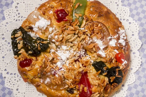 Portuguese King Cake is a famous christmas celebration cake with dry nuts and crystalized fruits.