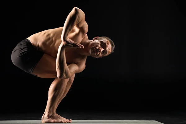 Athletic Man Practicing Yoga Palms Together Performing Twisted Chair Pose — Stock Photo, Image