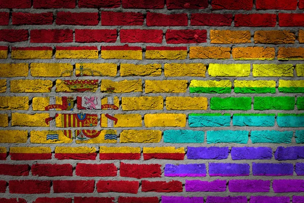 黑砖砌墙的纹理 国家国旗和彩虹旗画在墙上 西班牙 — 图库照片