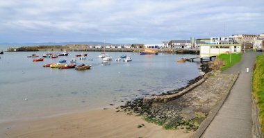 Small harbour with boats in the Portrush city, Northern Ireland. clipart