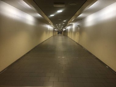 An industrial looking corridor, void of people clipart