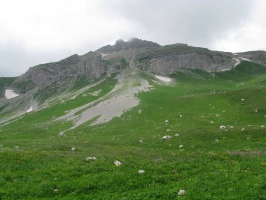 Mountains  rocks  a relief  a landscape  a hill  a panorama  Caucasus  top  a slope  clouds  the sky  a landscape clipart