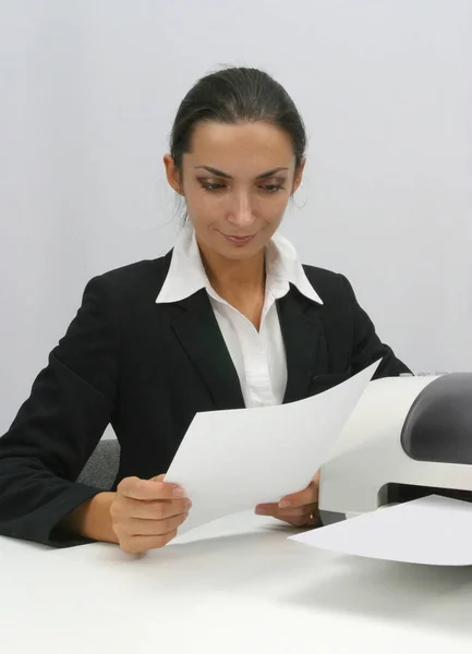 Business woman is prinring in office, copy, duplicate, calling