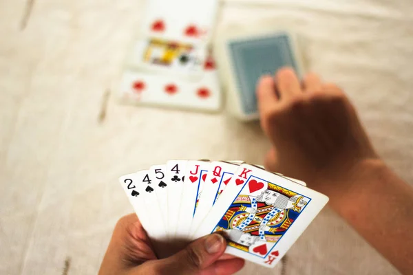 Woman Playing Poker Checking His Cards — Stock Photo, Image