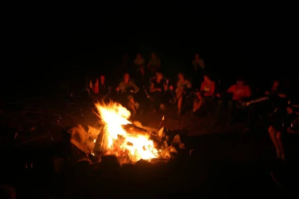 A campfire is a fire lit at a campsite, usually in a fire ring. Campfires are a popular feature of camping, particularly among organized campers