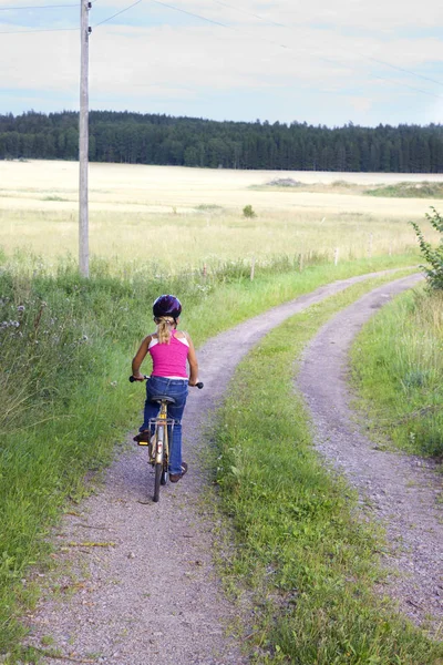 Niña en bicicleta en el parque — Foto de stock © mdegt #29545251