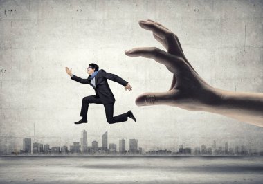 funny image of businessman trying to run away from hand clipart