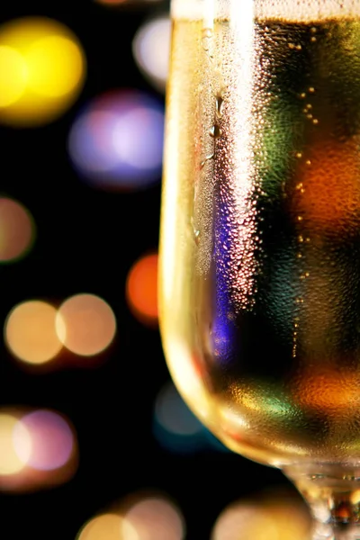 Festive Champagne Toast Close Glass Background Colourful Lights Black Shallow — Stock Photo, Image