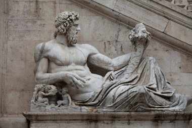 Rome - Sculpture of Tiber river in the Capitolium planed by Michelangelo. clipart