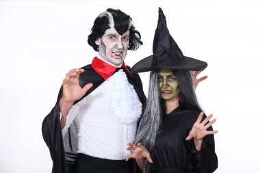 Man and woman in Halloween costumes clipart