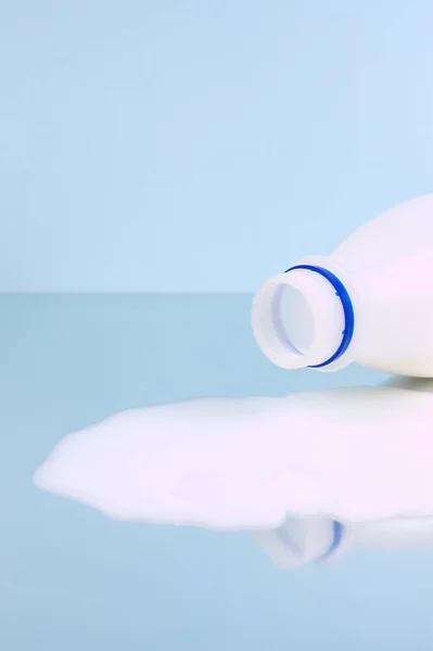 Spilt Full Cream Milk Isolated Blue Background — Stock Photo, Image