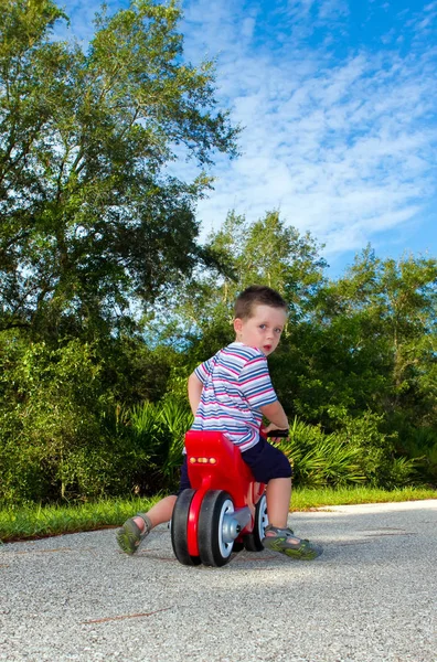 Niño Montando Una Moto Juguete — Foto de Stock