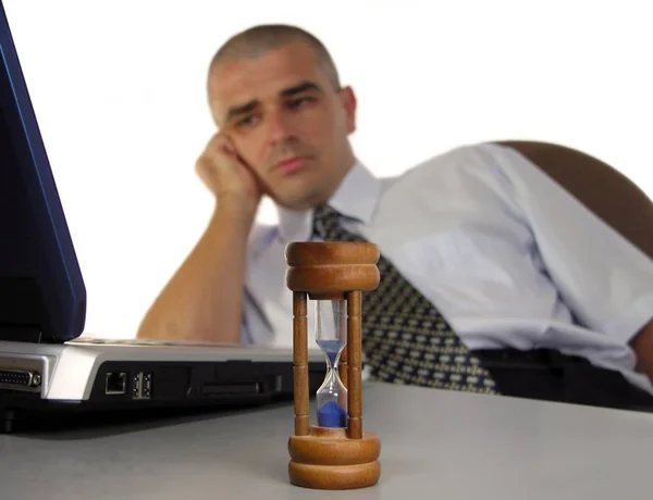 Tired Businessman End Workday Desk Metaphor Focus Sandglass Foreground Man — Stock Photo, Image