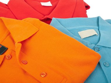 pile of man polo shirts on white background clipart