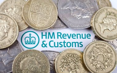 Revenue and Customs heading surrounded by coins. clipart