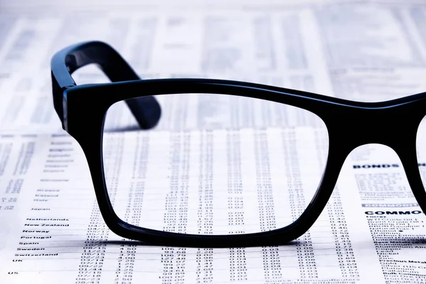 Closeup Glasses Financial Newspaper Light Tint Blue — Stock Photo, Image