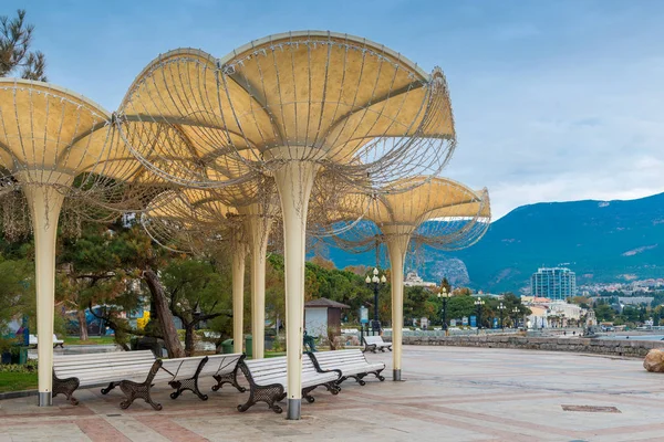 Business card of the city of Yalta of the Crimea peninsula - umbrellas on the embankment