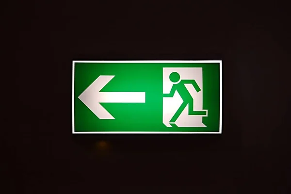 Emergency Exit Sign Glowing Dark — Stock Photo, Image