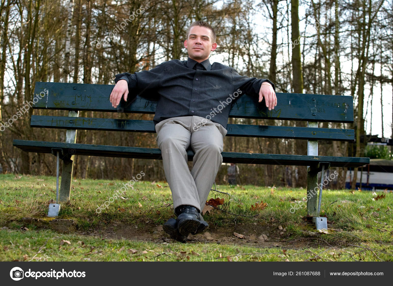 Young Man Sitting Bench Park Stock Photo