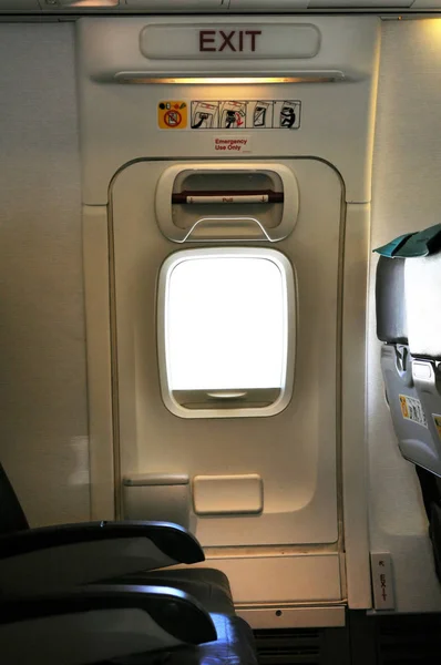 Emergency exit row. Passenger cabin of a commercial airliner