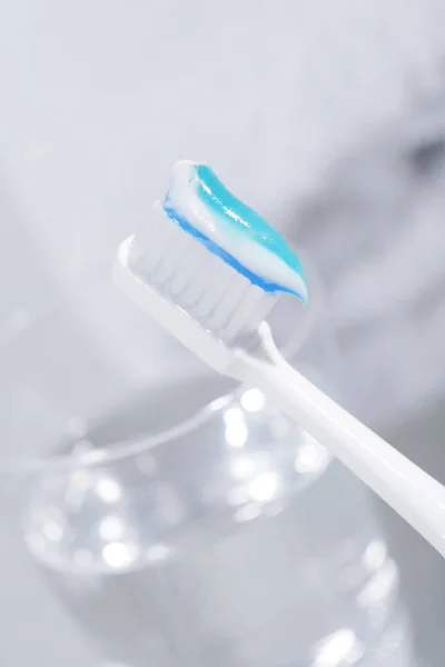 Toothbrush Some Toothpaste Glass Water — Stock Photo, Image