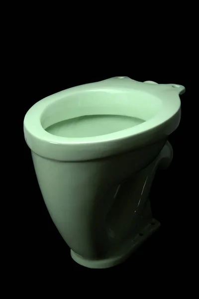 Die Hellgrüne Toilettenschüssel Isoliert Auf Schwarzem Hintergrund — Stockfoto