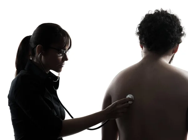 Uma Mulher Médico Segurando Estúdio Silhueta Estetoscópio Isolado Fundo Branco — Fotografia de Stock