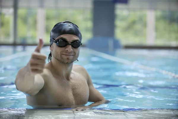 young healthy with muscular body man swim on swimming pool and representing healthy and recreation concept