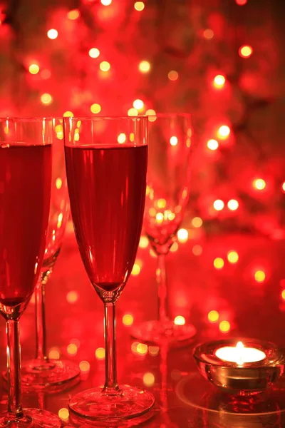 Champagne Glasses Red Background Twinkle Lights — Stock Photo, Image