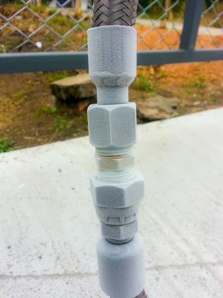 Close up of container with liquid nitrogen,Cold metal pipe smoking from transferring liquid nitrogen