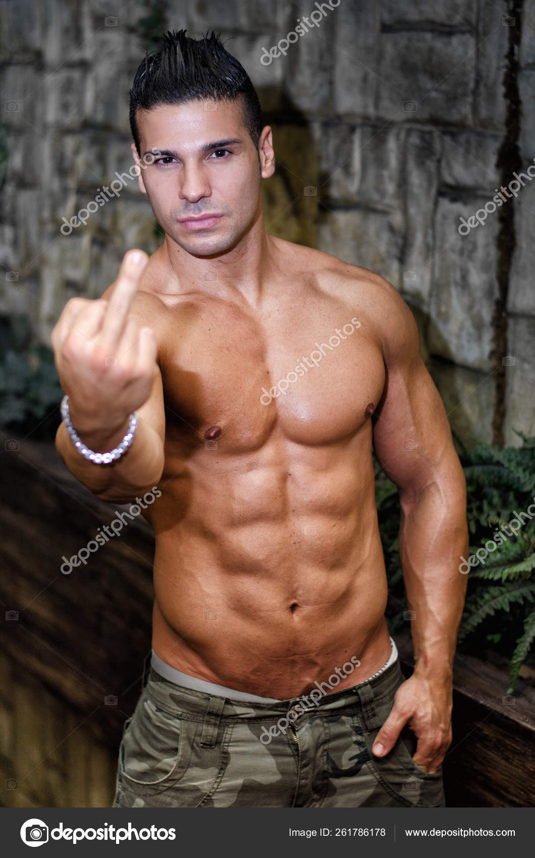 Muscular Shirtless Young Man Doing 'Screw You' Sign Middle Finger Stock  Photo by ©YAYImages 261786178