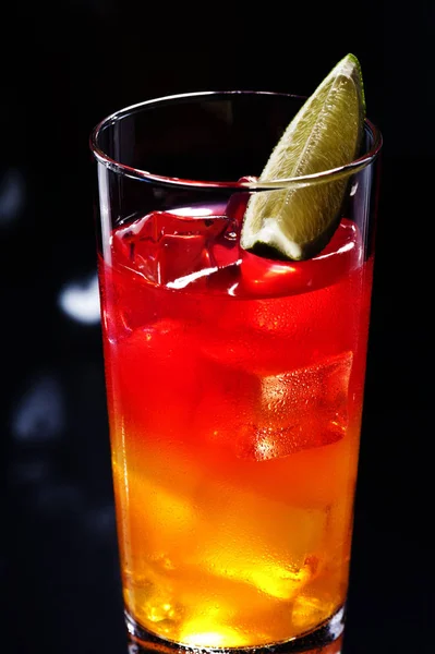 Tequila sunrise, the story about the drink says that it was first served in Cancun and Acapulco in the 1950\'s. After a brief surge in 70\'s discos, it lost much of its glory.