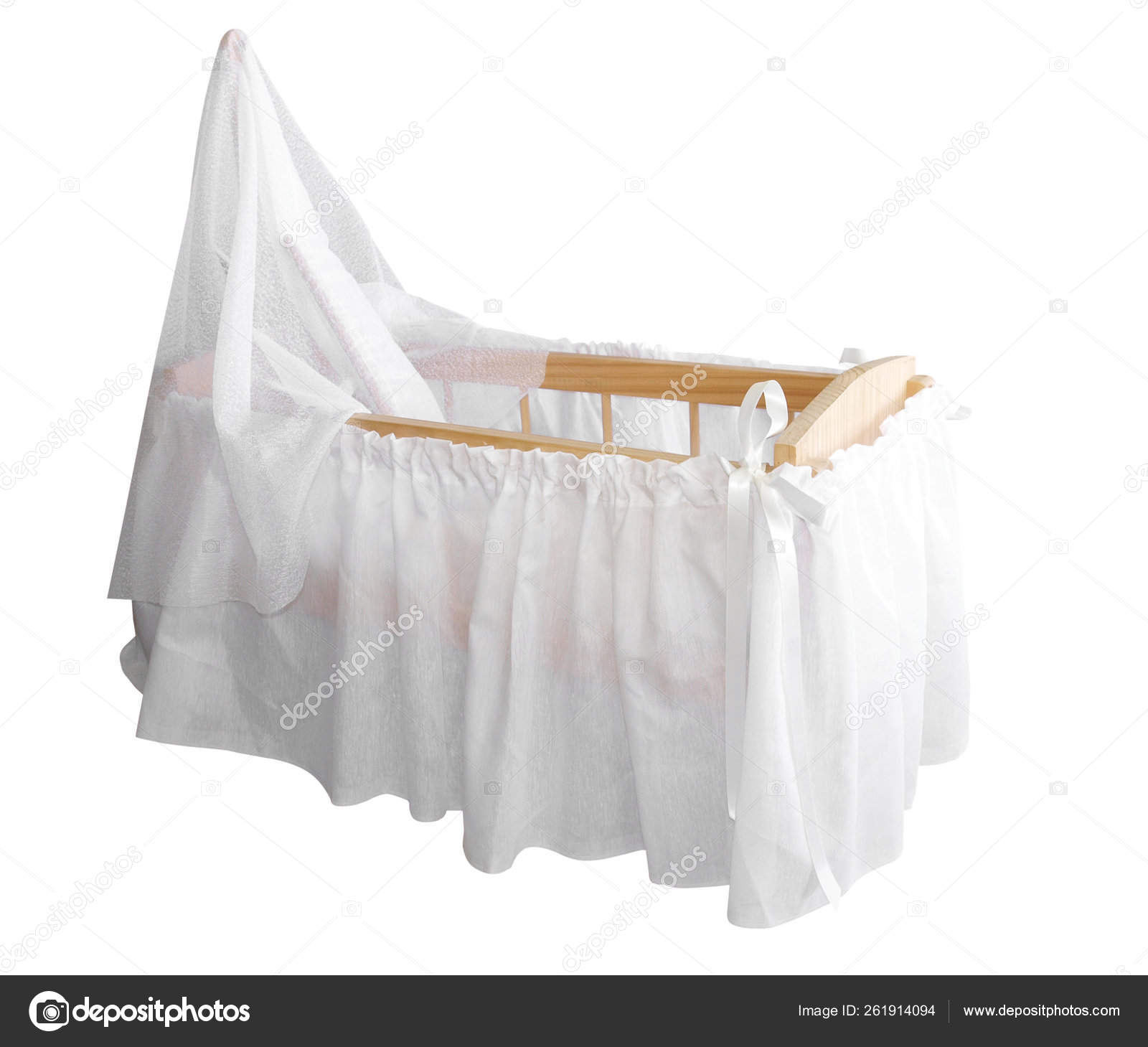 white wooden bassinet