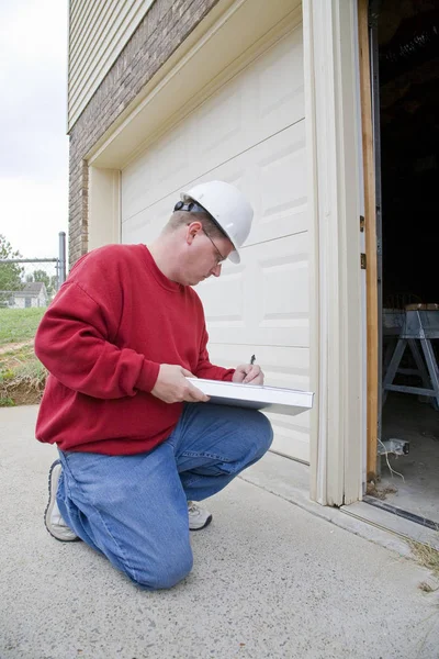 Home inspector looking for possible problems for a potential buyer, found rotted wood frame on exterior door frame