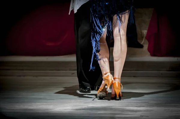 legs of a couple who dance in competition