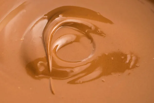 溶かしたミルクチョコレートの背景 — ストック写真
