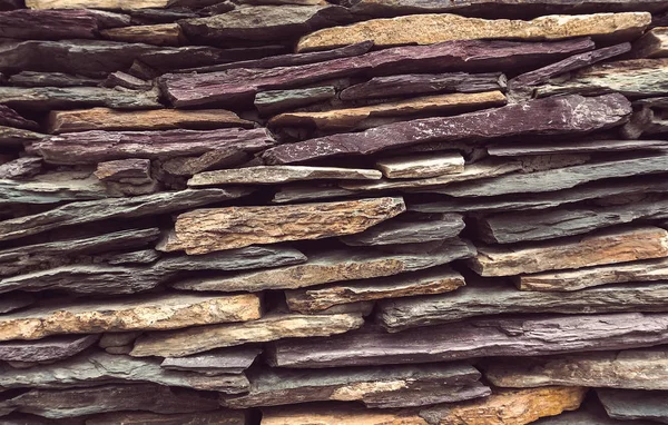 Flat stones stacked is unlikely. Stone texture construction.