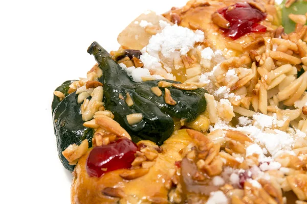 Portuguese King Cake is a famous christmas celebration cake with dry nuts and crystalized fruits.