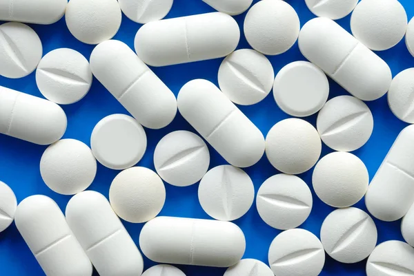 Macro Van Witte Pillen Blauwe Achtergrond — Stockfoto