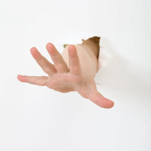 Barnets Hand Sticka Från Hål Papper — Stockfoto