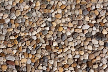 Closeup photo of uniformly distributed small stones clipart