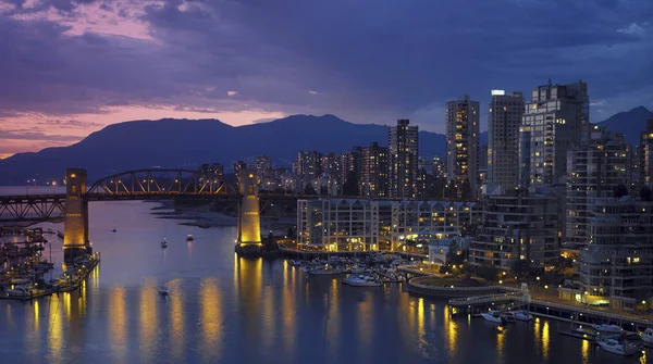 Yaletown and the Burrard Bridge in False Creek in the city of Vancouver, British Columbia in Canada.