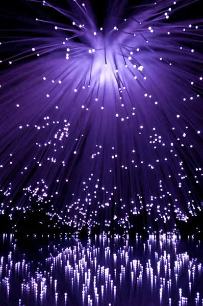 Purple Fibre Optic Light Strands Cascading Black Background Reflecting Foreground — Stock Photo, Image