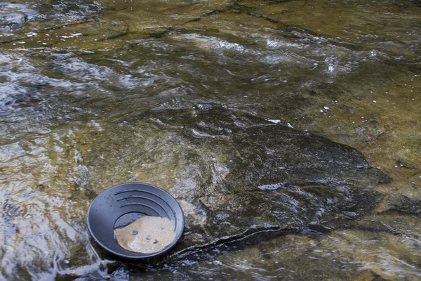 gold panning iin a small stream in northern michigan